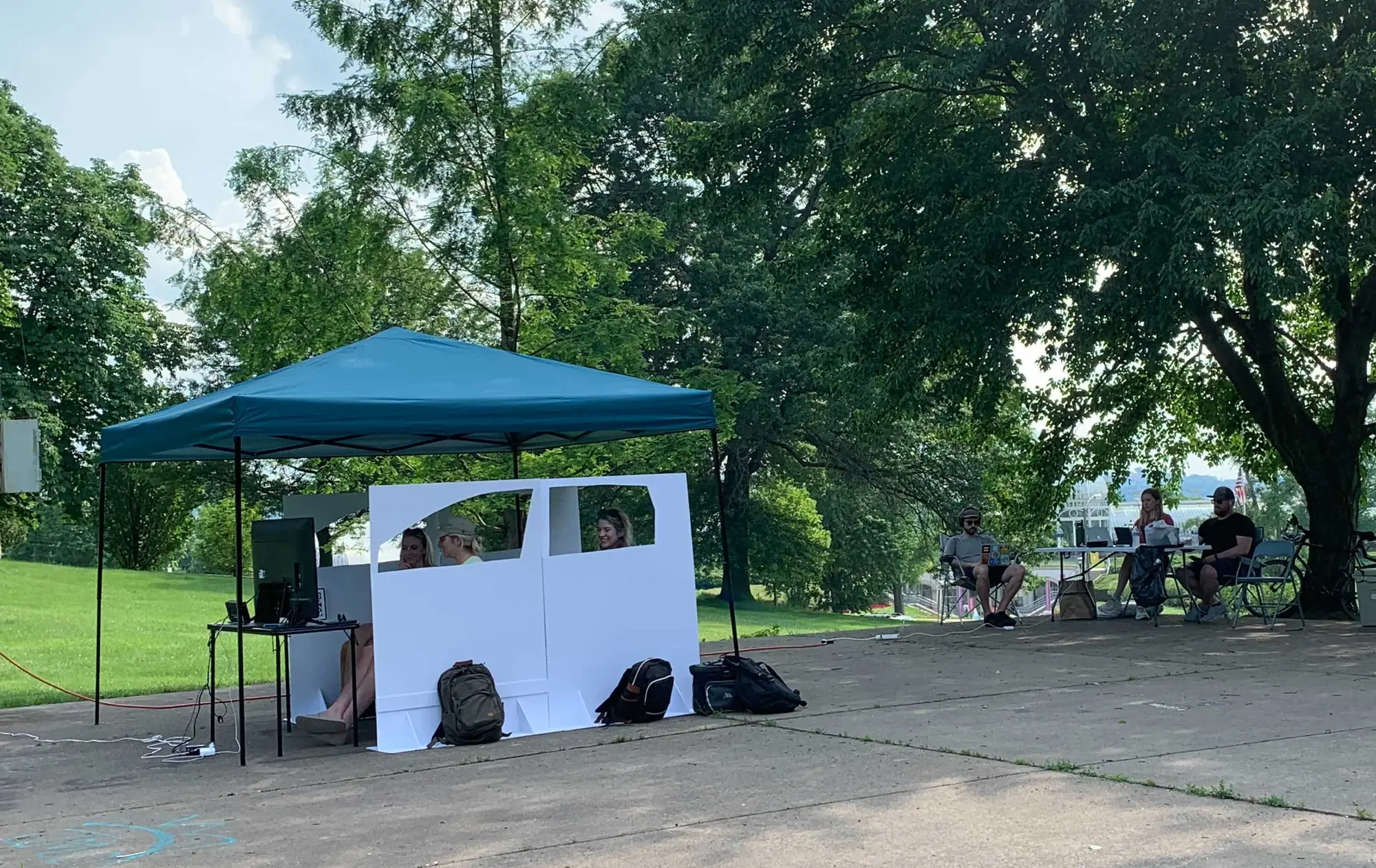user research: car simulator and team controlling it from a deck behind
