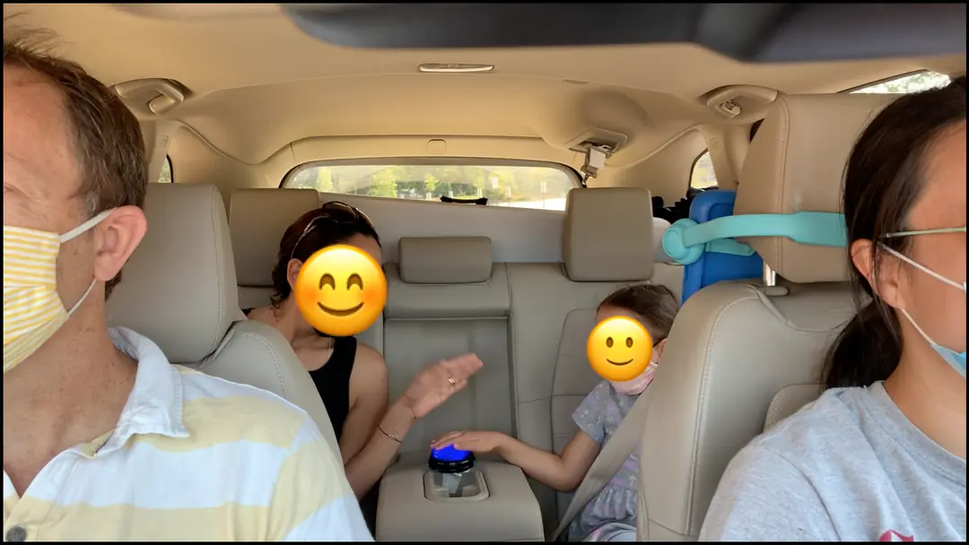 user research: Family playing button pressing game Simon in the car